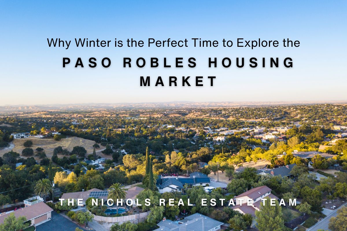 Aerial view of Paso Robles with rolling hills, residential homes, and greenery under a clear blue sky, featuring text about the Paso Robles housing market and The Nichols Real Estate Team.
